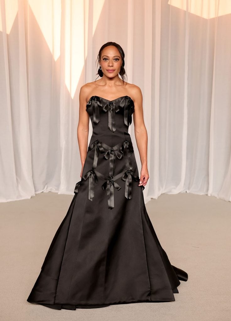 Rosalind Eleazar in a black Prada strapless gown decorated with satin bows at the 2026 Academy Museum Gala in Los Angeles