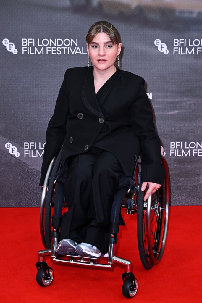 Ruth Madeley in a black Louis Vuitton tailored suit with Galaxie diamond earrings at the 'Being Heumann' BFI London Film Festival premiere.