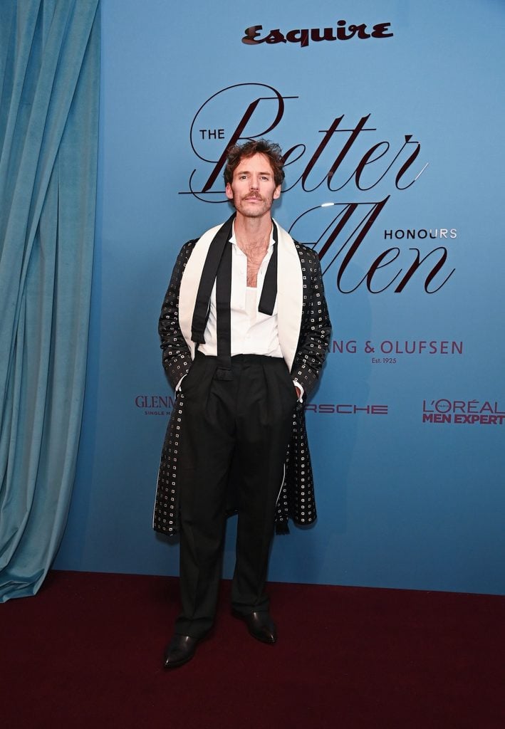 Sam Claflin in Tom Ford by Haider Ackermann Fall 2026 with a patterned evening coat and draped scarf at Esquire UK's Better Men Honours in London.