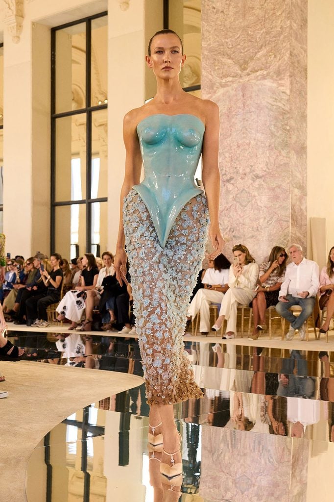 Schiaparelli Fall 2026 Haute Couture pale-blue silicone breastplate gown with a floral-embellished sheer skirt on the runway