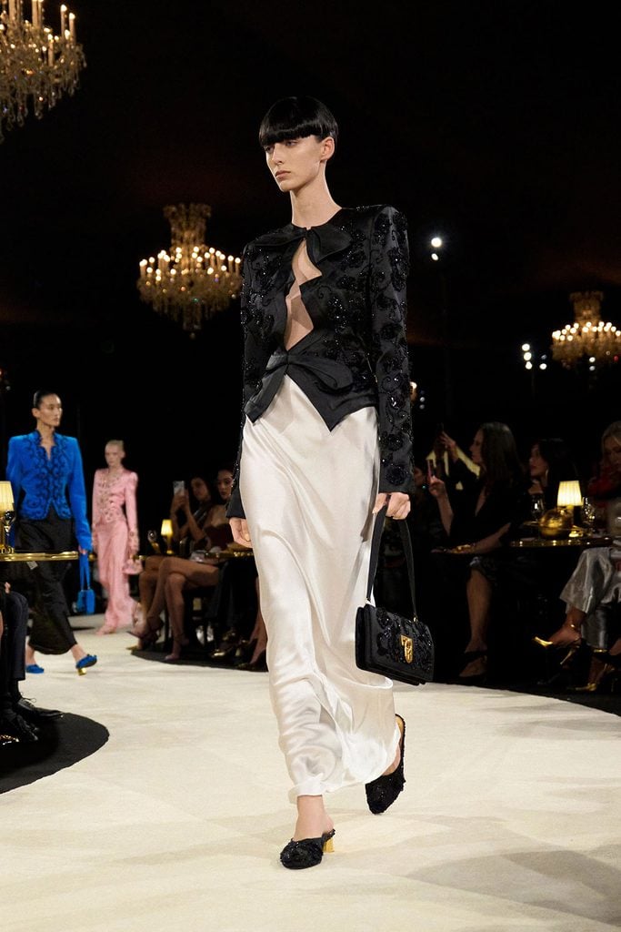 Schiaparelli Spring 2027 runway look featuring the Elsa jacket and ivory satin skirt, later worn by Rosalía at the WSJ. Magazine Innovator Awards.