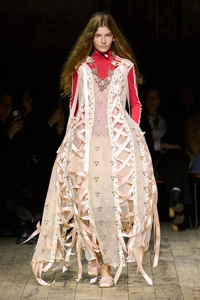 Model wearing the ribbon-trimmed embroidered tulle dress from the Simone Rocha Fall 2026 collection.