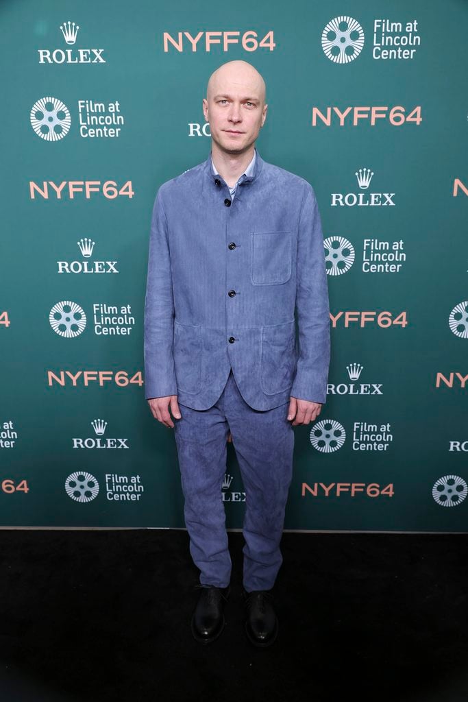 Yura Borisov wearing a blue Berluti corduroy-effect suede suit with black shoes at the 'Artificial' premiere during the 2026 New York Film Festival.