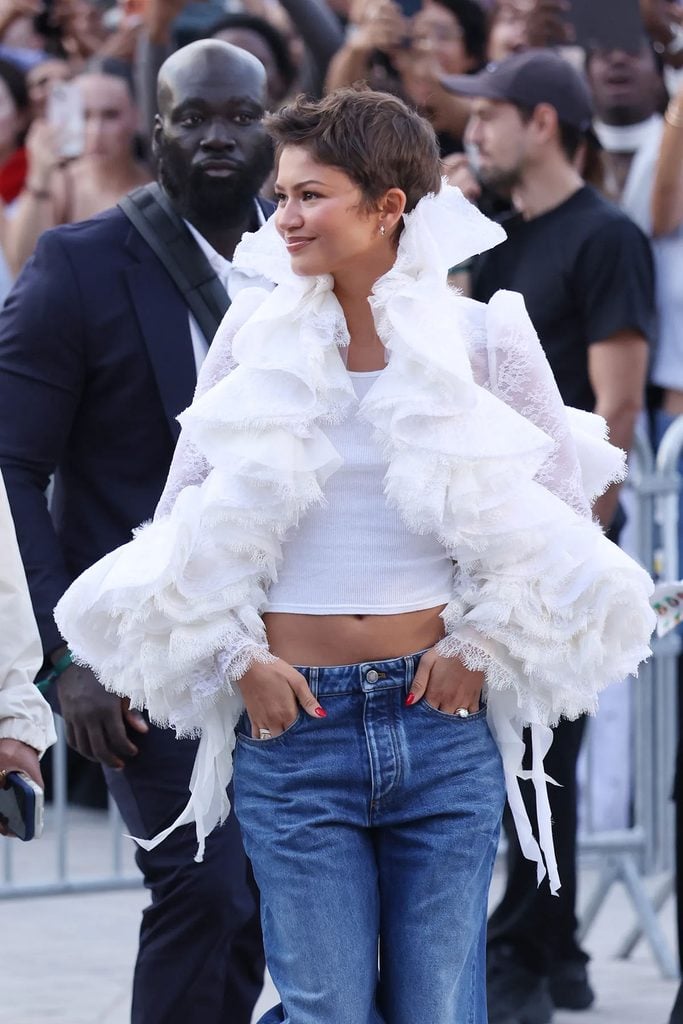 Zendaya wearing the white Louis Vuitton ruffled piece previously worn to the The Odyssey premiere in July 2026 to the Louis Vuitton Spring 2027 show